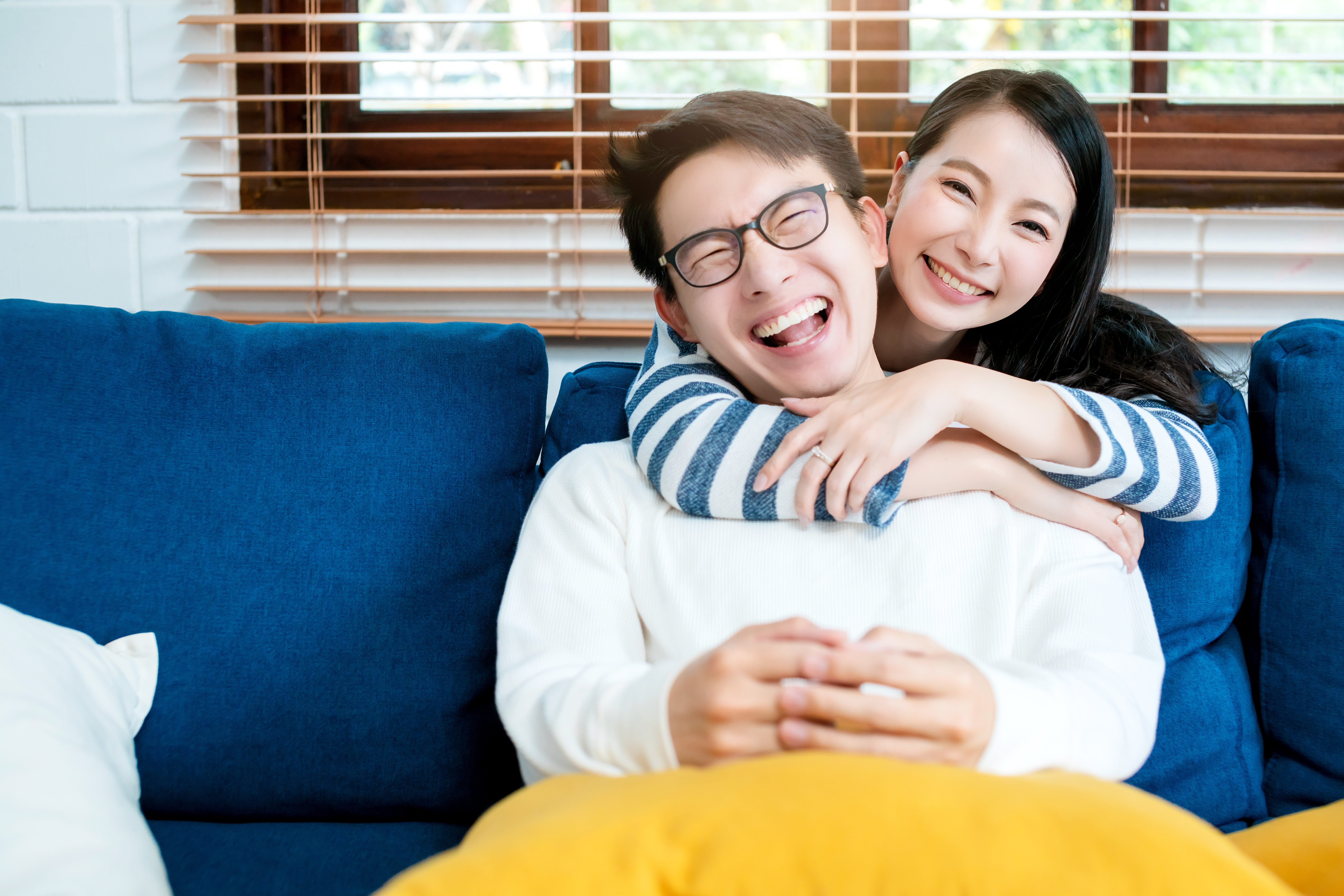 Happy couple at home — financial planning for families in Singapore